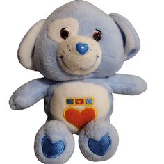 a blue teddy bear with a heart on it's chest