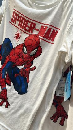 a spider man t - shirt is on display in a store