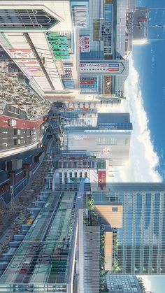 an aerial view of a city with skyscrapers and train tracks in the foreground