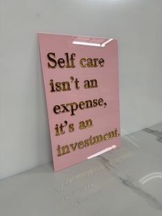 a pink sign that says self care isn't an expensive it's an investment