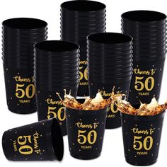 black plastic cups with gold foil numbers and confetti on the rims, set of 50