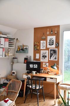 a home office with a desk, chair and pictures on the wall above it that reads'1033 '