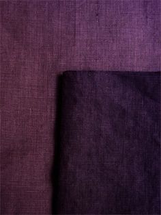 two different shades of purple and black fabric