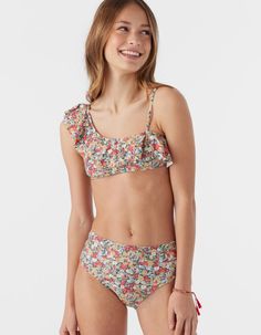 O'neill Eden Ditsy Asymmetrical Ruffle Top Bikini Set. Allover Print. Asymmetrical Ruffle Top Detail. Removable Cups Sizes 10+. Matching Full Coverage High-Waist Bottom. 82% Recycled Polyamide 18% Elastane. Hand Wash. Imported. | O'neill Eden Ditsy Asymmetrical Girls Ruffle Top Bikini Set Pretty Swimwear, Full Coverage Swimsuit, Flannel Sweatshirt, Flannel Outfits, Girls Swimwear, Spring Suit, Denim Sweater, Swim Sets