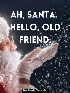 a man dressed as santa claus blowing snow in the air with words above him that say, ah, santa hello, old friend