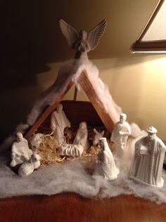 a nativity scene with figurines and lights