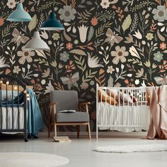 a baby's room with floral wallpaper and crib in the foreground