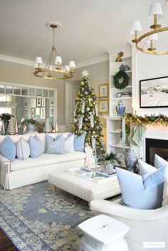 a living room filled with furniture and a christmas tree