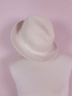 "Experience timeless style with our vintage fedora hat. This 1970s Italian-made fedora is crafted from high-quality cream wool. Finished with a cream ribbed ribbon. Era - 1970s Fabric - Wool Inner rim 8\" length x 6\" width Outer hat - 12\" length x 10.5\" width Label size 85 Great condition" 1970s Fabric, Wool Fedora Hat, Fabric Wool, Wool Fedora, Prairie Dress, Fedora Hat, Blouse Vintage, Cotton Lace, Fedora