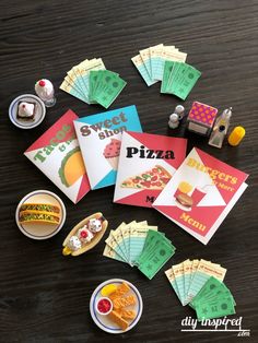 a table topped with lots of cards and food