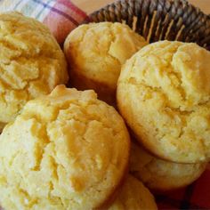 a basket filled with muffins sitting on top of a table