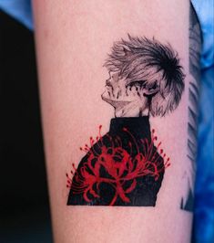 a person with a red and black tattoo on their arm is looking at the camera