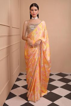 Yellow digitally printed silk satin saree in a delightful yellow hue, pink highlights and embroidered border. Paired with embroidered blouse and satin petticoat.
Components: 3
Pattern: Embroidered, Printed
Type Of Work: Geometric
Neckline: Square
Sleeve Type: Sleeveless
Fabric: Saree - Silk Satin, Petticoat- Satin, Blouse- Dupion
Color: Yellow
Other Details: 
Back deep neck
Embroidered detailing
Model height: 5ft 8inches, wearing size XS
Occasion: Wedding - Aza Fashions Festive Silk Pre-draped Saree With Printed Motifs, Navratri Party Pre-draped Saree With Printed Motifs, Bollywood Style Silk Sets With Digital Print, Elegant Party Saree With Printed Motifs, Festive Elegant Saree With Digital Print, Elegant Wedding Saree With Digital Print, Elegant Designer Saree With Digital Print, Elegant Digital Print Saree For Designer Wear, Bollywood Style Digital Print Pre-draped Saree For Diwali