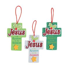 three christmas ornament ornaments with the words jesus and reason in red, green and yellow