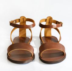 A casual sandal is topped with high quality leather straps, giving a chic and elegant style. Additional strap on heel offers extra stability, making an all-day comfort sandal. *The sandals in the images are in Dark chocolate brown leather. * Finest Quality Leather Genuine leather that comes from the island of Crete and it is famous for it's superior quality and uniqueness is picked one by one for our leather sandals. Ancient greek sandals were inspired and first created there. * Flexible Vibram Chic Brown Adjustable T-strap Sandals, Summer Ankle Strap T-strap Sandals With Leather Lining, Summer Leather Lining T-strap Ankle Strap Sandals, Brown Double Strap Slingback Sandals, Dark Chocolate Brown, Brown Leather Sandals, Estilo Chic, Ancient Greek Sandals, Greek Sandals