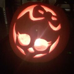 a pumpkin carved to look like a cat