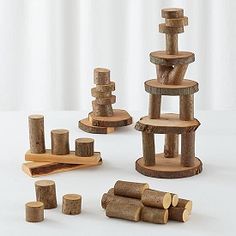 several pieces of wood stacked on top of each other with one piece cut out to make a tower