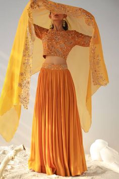 Ochre blouse with all over floral jaal pattern, threads, zari and moti hand embroidery. Paired with intricate pleated lehenga and floral embroidered bordered dupatta. - Aza Fashions Orange Dupatta With Intricate Embroidery For Reception, Orange Embroidered Choli For Reception, Orange Embroidered Sets For Reception, Embroidered Orange Choli For Reception, Semi-stitched Orange Choli With Intricate Embroidery, Orange Semi-stitched Choli With Intricate Embroidery, Orange Saree Set With Intricate Embroidery, Orange Festive Set With Intricate Embroidery, Reception Embroidered Chinon Sets