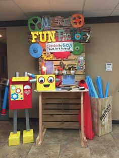 an office decorated with cardboard boxes and magnets on the front desk for kids to use