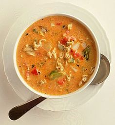 a white bowl filled with soup on top of a table