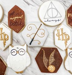 harry potter cookies are arranged on a marble surface