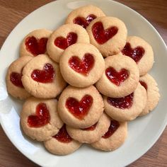 heart shaped cookies arranged on a plate with ketchup in the shape of hearts