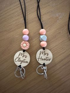 two key chains with charms attached to them