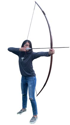 a woman holding a bow and arrow in her hands