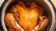 a whole chicken in the crock pot ready to be cooked