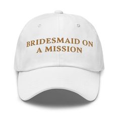 a white hat with the words bridesmaid on a mission written in gold letters