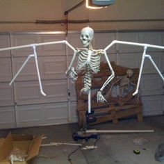 a skeleton is standing in front of a garage door with arms and legs stretched out