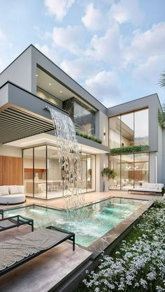 a modern house with a pool in the middle