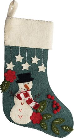 a christmas stocking with a snowman and stars hanging from it's side