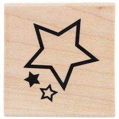 a wooden stamp with three stars on the bottom and one star in the middle,