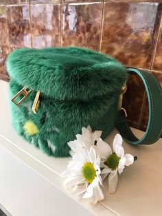 Daisy flower mink fur box bag, made of real mink fur,  sparkly pattern cow Leather lining and green leather hand-strap   size: L 11, D 11, H 12 cm Luxury Faux Fur Rectangular Shoulder Bag, Luxury Rectangular Faux Fur Shoulder Bag, Evening Rectangular Bag With Faux Fur Lining, Luxury Faux Fur Evening Bag, Green Rectangular Shoulder Bag For Winter, Luxury Evening Bags In Faux Fur, Rectangular Faux Fur Shoulder Bag, Rectangular Faux Fur Evening Bag, Fur Handbag