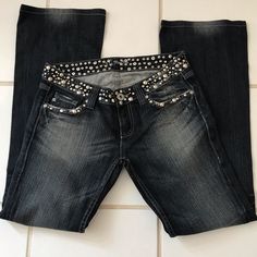 These Are Fantastic! They Have Silver Studs And Black Crystals Mounted In Silver Covering The Whole Waist Band, Going Across The Front Pockets And Covering The Full Flap On Back Pockets. The Are A Dark Blue Distressed With Flare Legs. They Have 32in Inseam. They Have Never Been Worn Or Cleaned. The Distressing Is Great Too. They Are Definitely Some Something Special Jeans Jeans With Crosses On Them, Blingy Jeans, Thrift Manifestation, Special Jeans, Stud Clothing, Bedazzled Jeans, Rock Jeans, Art College, Flair Jeans