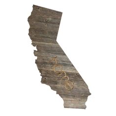 a wooden california state with the word love spelled in gold on it's side