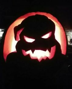 a carved pumpkin with an evil face on it