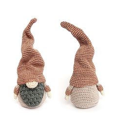 two crocheted gnomes sitting next to each other