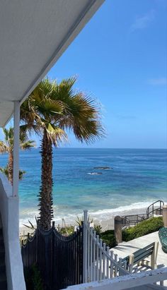 an ocean view from the balcony of a house