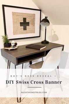 a desk with a lamp and some pictures on the wall above it that says diy swiss cross banner