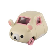 a small toy car with a face on it's front window and ears sticking out