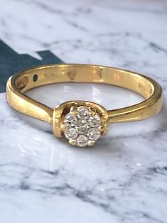 Vintage 10k Yellow Gold Diamond Cluster Ring Size 7.75 BEAUTY!! Beautiful ring! Expertly crafted in solid 10k yellow gold with a round genuine diamond cluster center! * Seven (7) round .02ct bright natural diamonds make up the center cluster. * Hallmarked 10k * 2.1 grams of 10k * Size 7.75 Shipped FAST and FREE, insured and gift boxed :) I guarantee item to be exactly as described and pictured 14k Gold Cluster Ring, Vintage Fans, Gold Rope Chains, Diamond Bangles Bracelet, Gold Gift, Black Gift Boxes, Diamond Bangle, Diamond Cluster Ring, Beautiful Ring