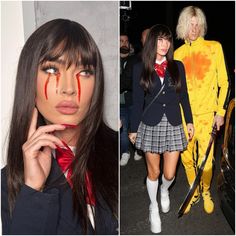 two women dressed in costumes and one with blood painted on her face, both wearing school uniforms