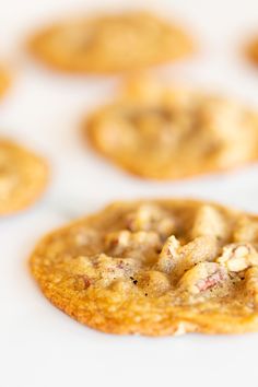 several cookies sitting on top of a white table with one cookie missing from it's center