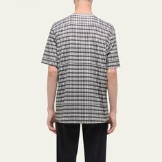 Helmut Lang T-shirt in two-tone check Crew neckline Embroidered logo at chest Short sleeve; approx. 19.3"L Relaxed fit Pullover style Cotton Unlined Machine wash cold Made in Portugal Casual Cotton Tops With Grid Pattern, Casual Plaid Cotton T-shirt, Casual Plaid Short Sleeve T-shirt, Helmut Lang, Pullover Styling, Crew Neckline, Portugal, Tops Designs, Relaxed Fit