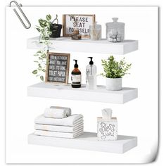 three white shelves with towels, plants and other items on them