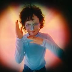 a woman making the vulcan sign with her hands