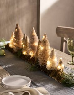 the table is set with white plates and silverware