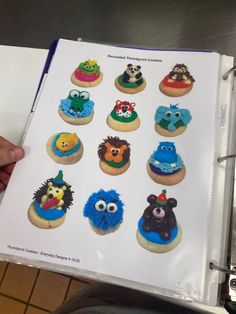 an open book with sesame street cupcakes on it